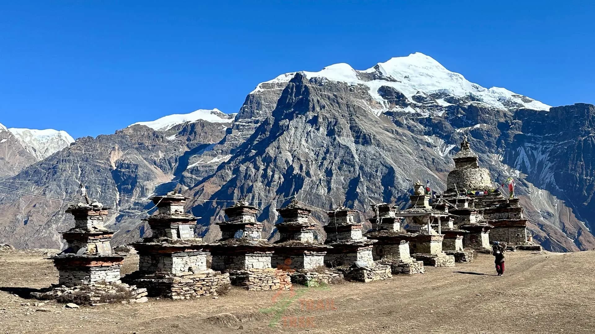 Old chortens (memorials) and the view of mountain peaks during the Nar Phu trek