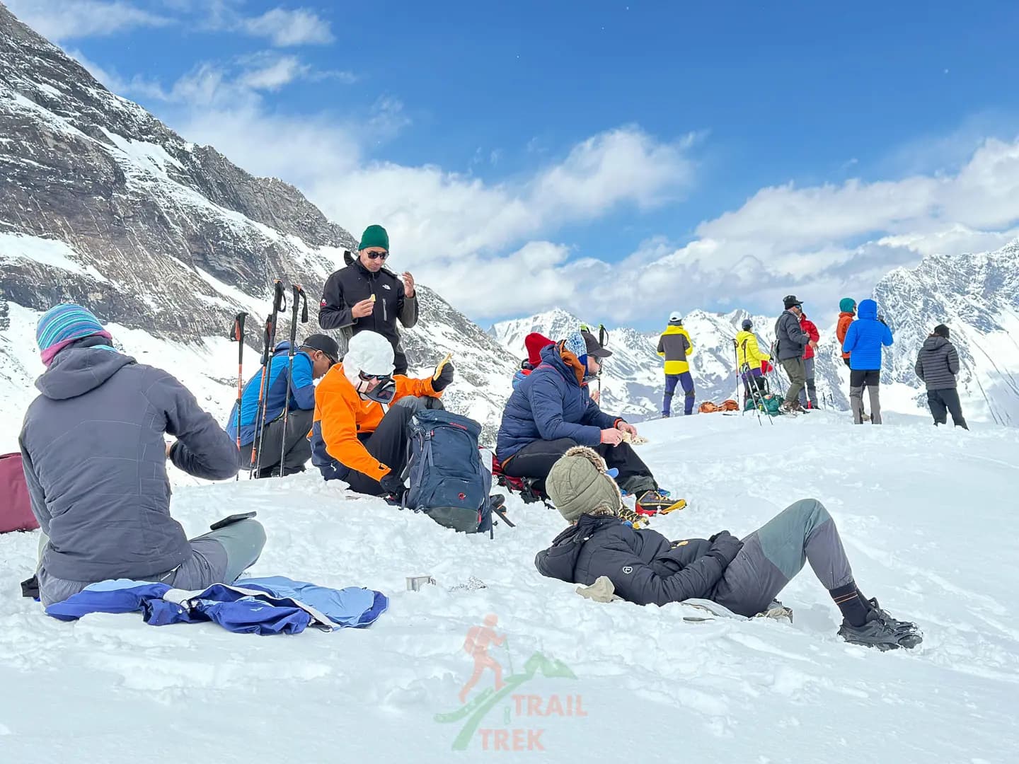 trekkers resting near larkya la pass