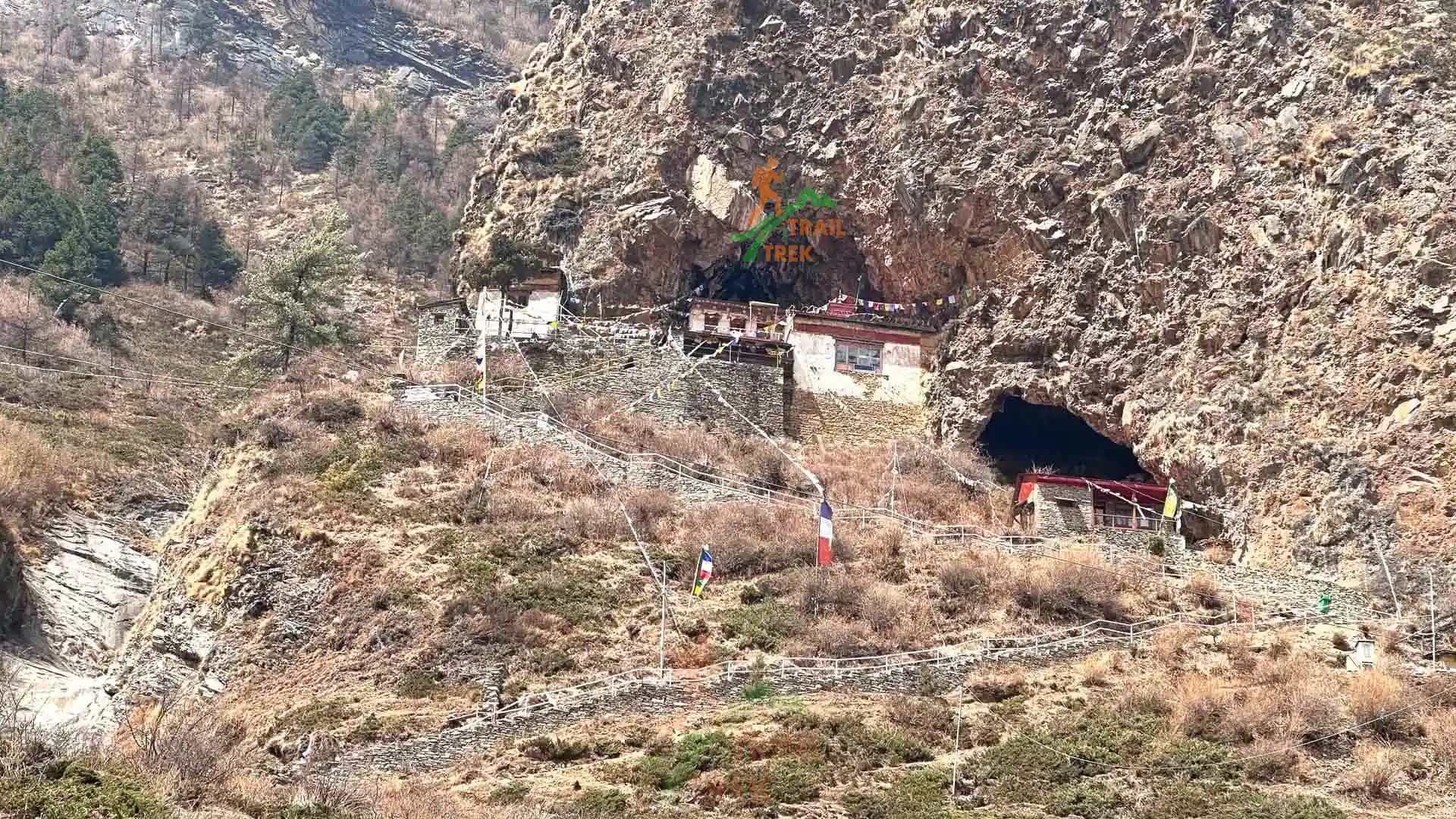 anceint caves and buddhist monastery by the hill at Tsum Valley trek